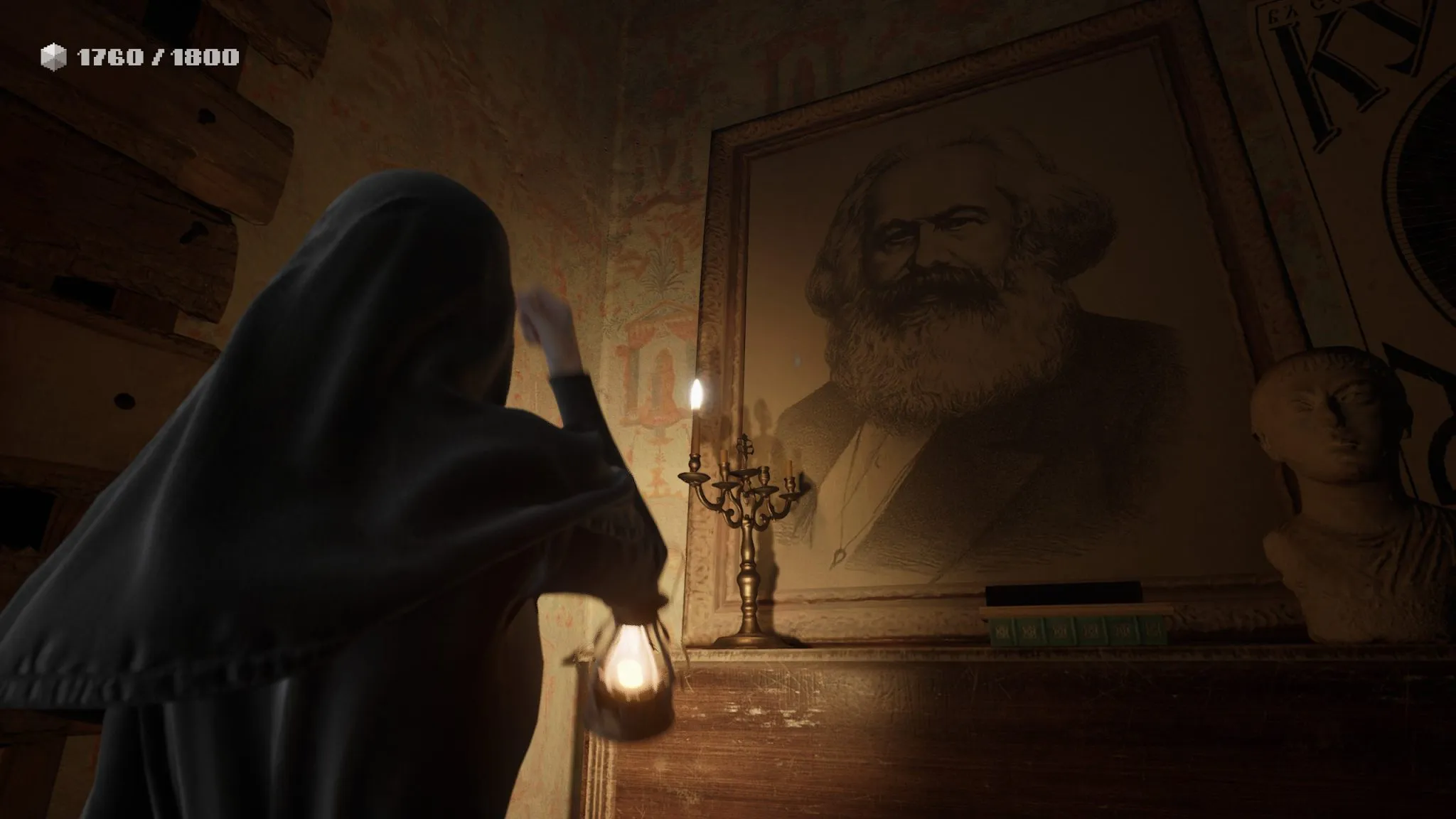 Indika - The girl has lit a candle and prays to Karl Marx